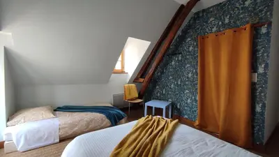 Un ou plusieurs lits dans un hébergement de l'établissement Le Relais des Fontaines