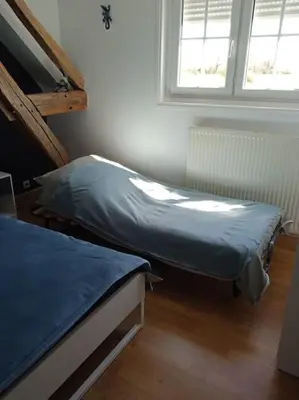 Un ou plusieurs lits dans un hébergement de l'établissement Gîte de groupe du Coudray
