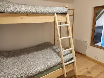 Un ou plusieurs lits dans un hébergement de l'établissement Détente au bord du Loir - Spa Sauna - Gîte 3