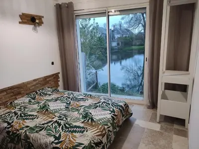 Un ou plusieurs lits dans un hébergement de l'établissement Détente au bord du Loir - Spa Sauna - Gîte 3