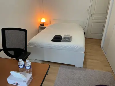 Un ou plusieurs lits dans un hébergement de l'établissement Chambres dans maison familiale