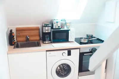 Cuisine ou kitchenette dans l'établissement Cube du Serpent Royal - Charmante Mezzanine