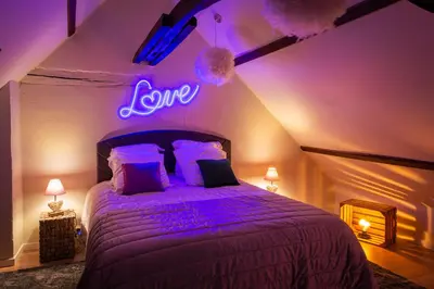 Un ou plusieurs lits dans un hébergement de l'établissement Pour Toi et Moi - Loveroom