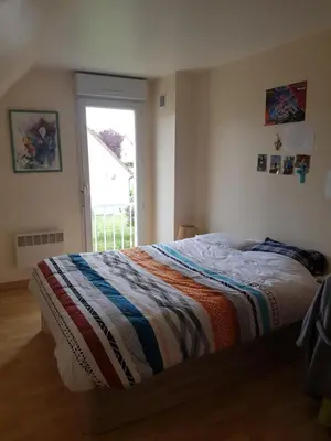 Un ou plusieurs lits dans un hébergement de l'établissement Chambres chez l'habitant